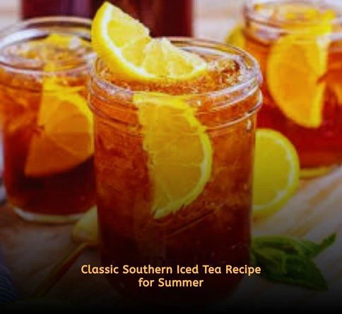 Glass pitcher of iced tea with mint leaves and lemon slices