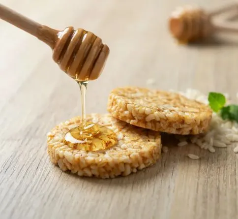Rice Cakes with Honey Rice cakes drizzled with honey, a light pre-workout energy snack