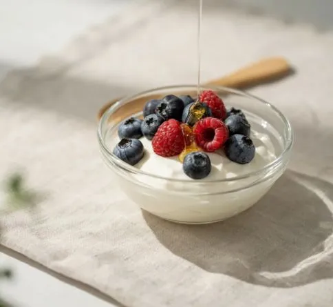 Plain Greek Yogurt with Berries Greek yogurt with fresh berries, a protein-rich pre-workout snack