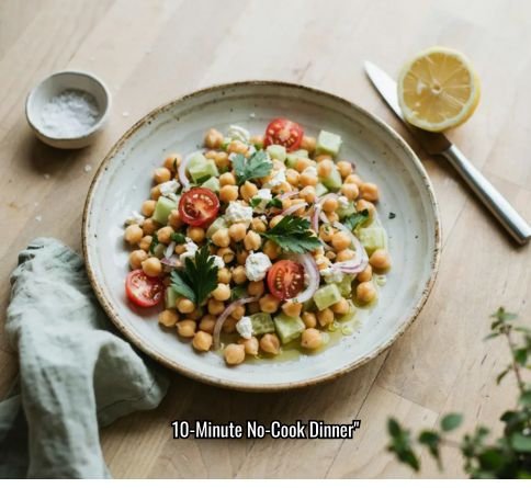 Mediterranean chickpea salad bowl with cucumber, tomato, red onion, and feta