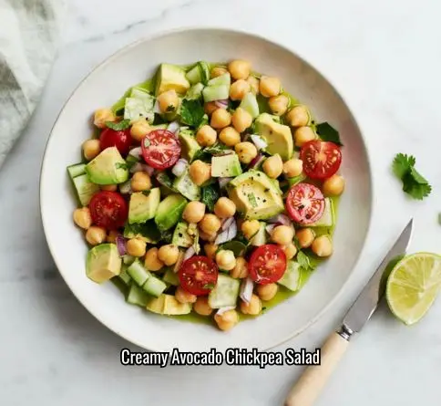 Avocado chickpea salad with tomatoes cucumber and lime dressing