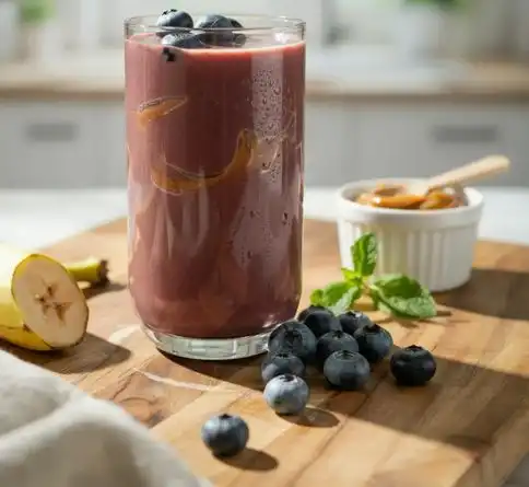Blueberry banana almond fruit smoothie recipe with almond butter drizzle
