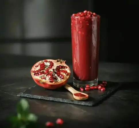 Pomegranate berry antioxidant fruit smoothie recipe with fresh pomegranate arils