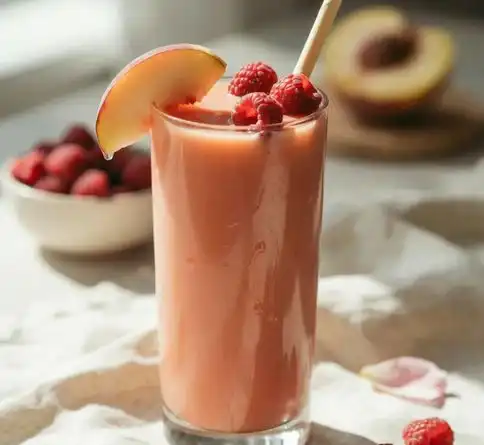 Nectarine raspberry fruit smoothie recipe with fresh raspberries on top