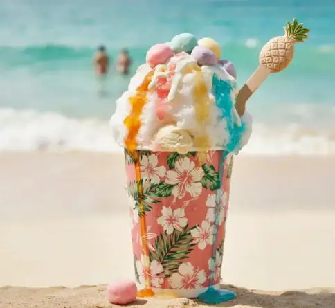 Colorful Hawaiian shave ice topped with tropical syrups, condensed milk, and soft mochi pieces.