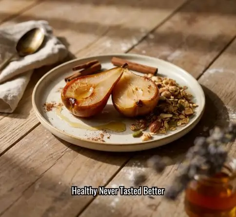Oven-baked pears drizzled with honey and topped with crunchy granola and cinnamon.