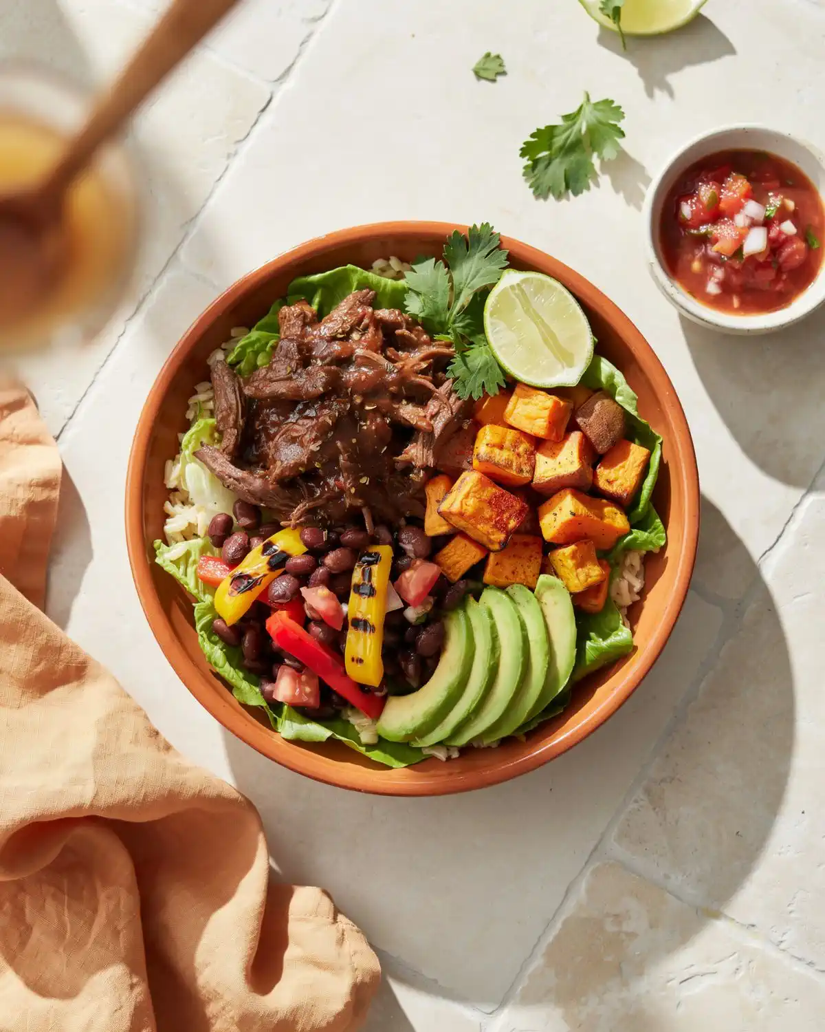 Three-bean pumpkin crockpot chili with black, kidney and pinto beans, peppers and avocado.